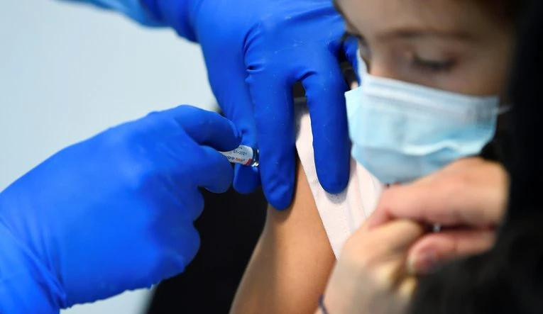 Vacunación, chicos, Reuters