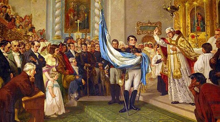 Bendición de la bandera de Belgrano por el canónigo Juan Ignacio Gorriti en la iglesia matriz de San Salvador de Jujuy, sostenida por Manuel Belgrano. Óleo de Luis de Servi. Foto: Wikipedia.