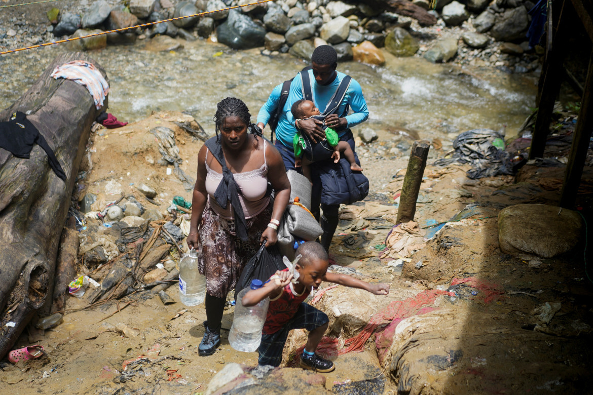 Familia de migrantes de Haití. Foto: Reuters.