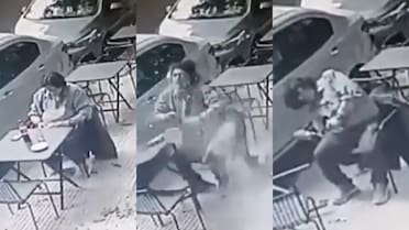 Vivo, pero de milagro: comía en la vereda y le cayó un blindex en la cabeza