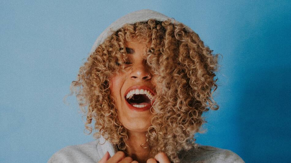 Persona feliz. Foto Unsplash.