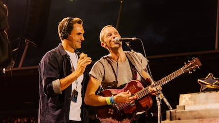 Roger Federer con Chris Martin. Foto: EFE.