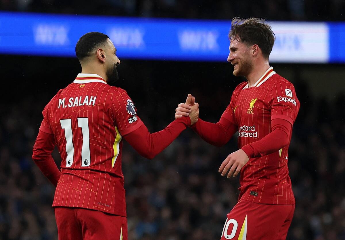 Alexis Mac Allister y Mohamed Salah, Liverpool vs Manchester City. Foto: Reuters/Lee Smith