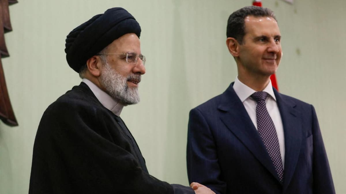 El presidente de Siria Bashar al-Assad y el presidente iraní Ebrahim Raisi _Foto Reuters