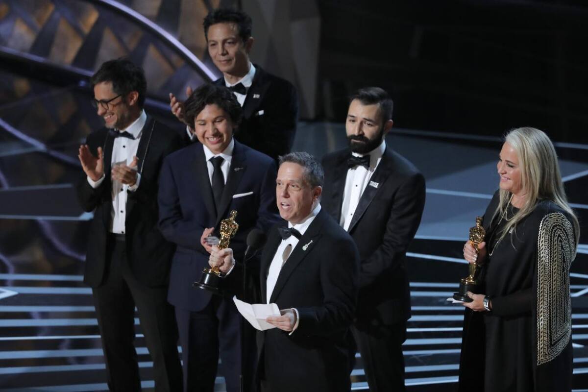 Lee Unkrich (L) y Darla K Anderson, directores de Coco, Oscar 2018