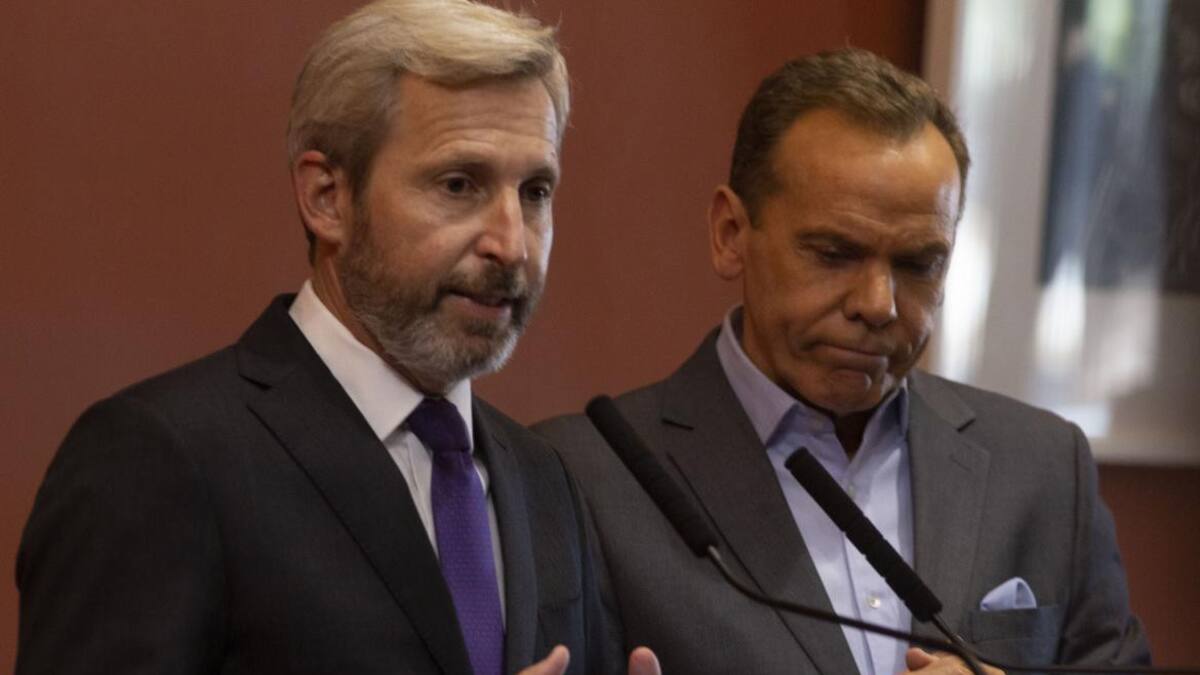 Rogelio Frigerio junto al director nacional de Migraciones, Horacio García, NA