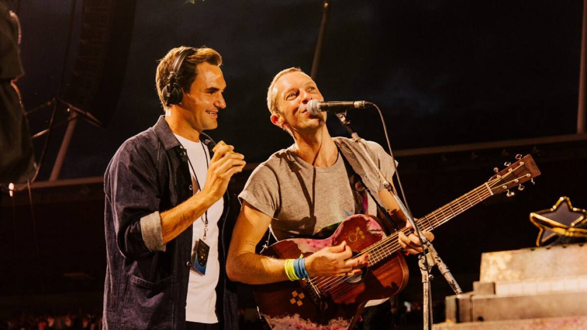 Roger Federer con Chris Martin. Foto: EFE.